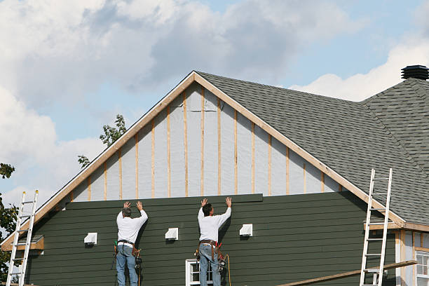 Professional Siding technician working in Norwich, NY